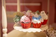 An assortment of Christmas decorated muffins on a tray