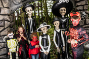 Children with a skeleton family posing