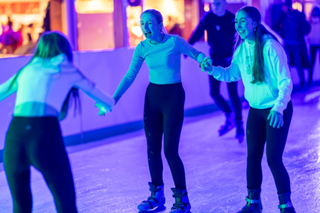Ice Skating three girls on ice rink