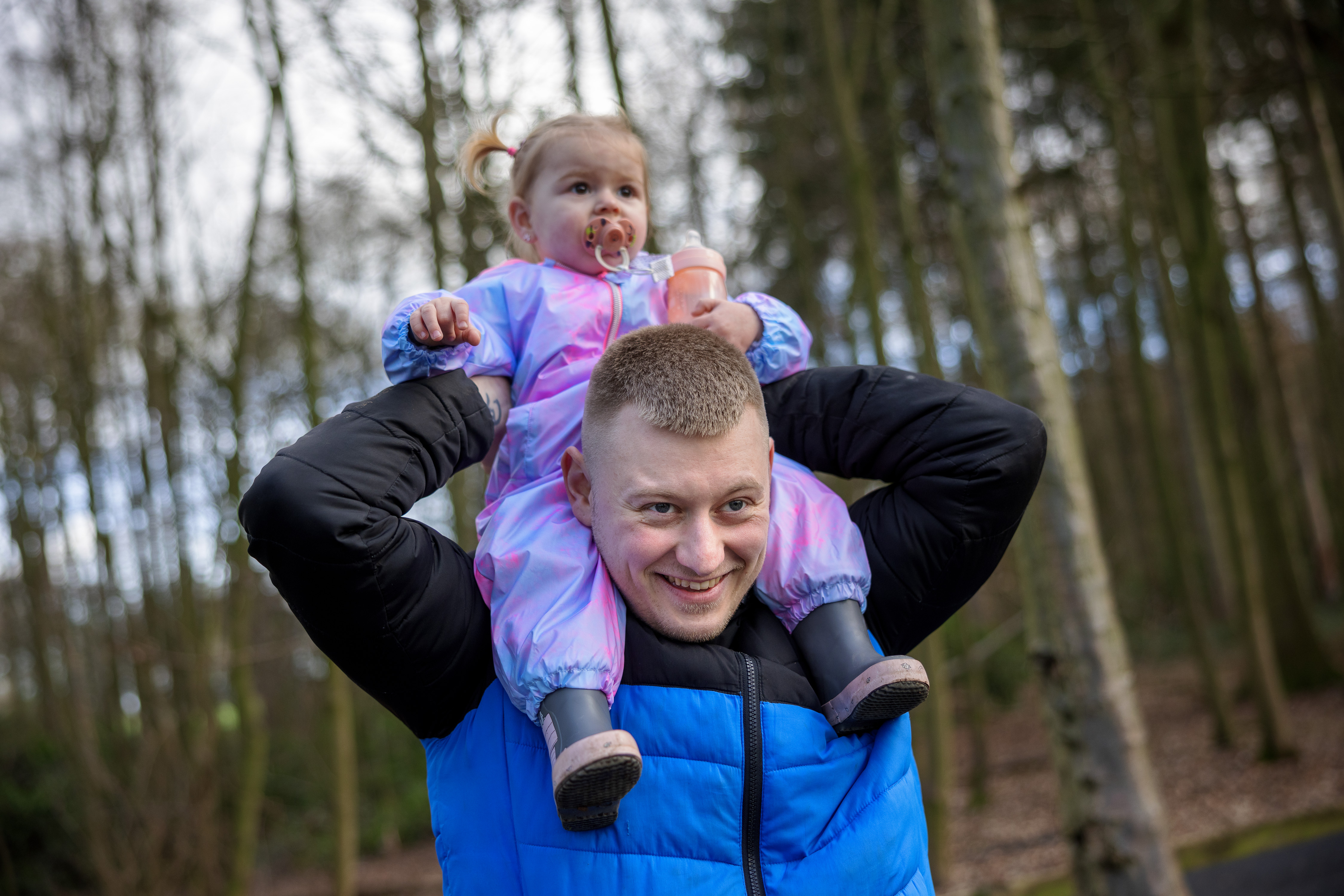 man and girl wearing wellies in forest