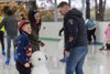 Family Ice Skating with Snowman Skating aid
