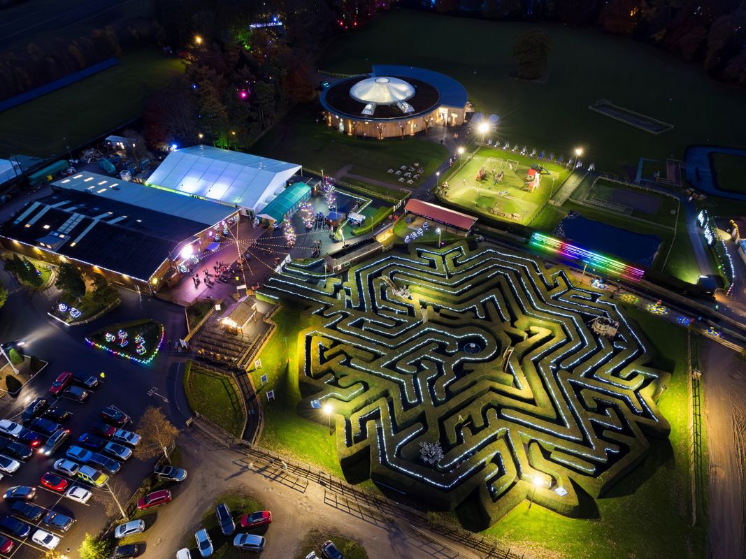 An overhead view of the park with christmas lights all over