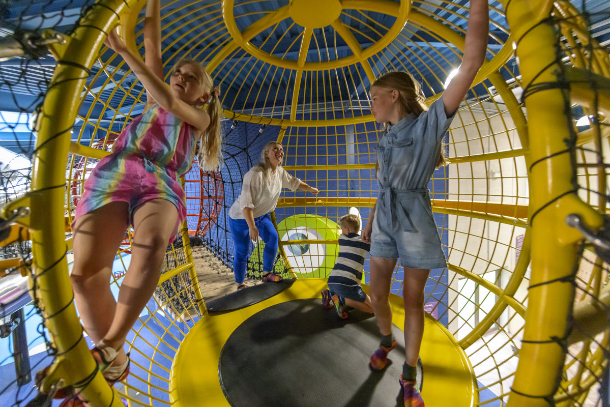 family playing in one of the floating planets