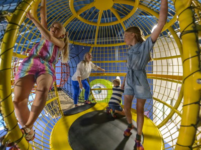 family playing in one of the floating planets
