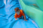 Boy sliding down the giant slide