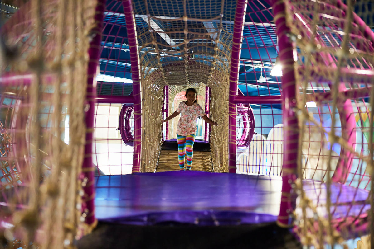 girl running through the jellyfish in the hive