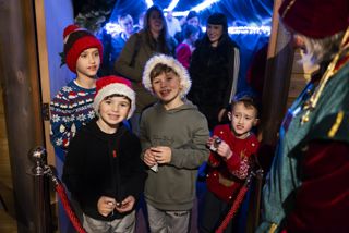 Children Entering Santas Grotto while smiling