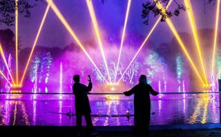 Two people watching the lake show