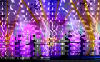 Two people watching the lake show