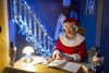 Mrs Claus sat at her desk smiling