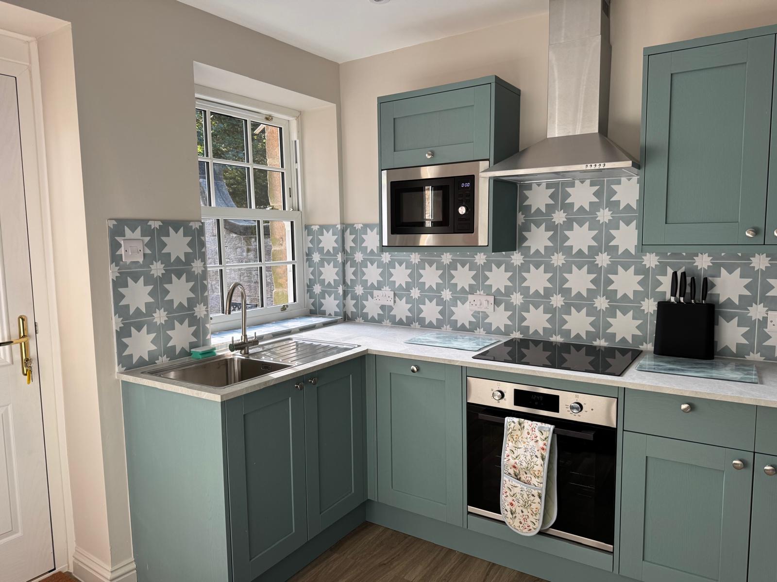 Stockeld Lodge kitchen with blue and white tiles. Luxury accommodation located near Harrogate and Wetherby
