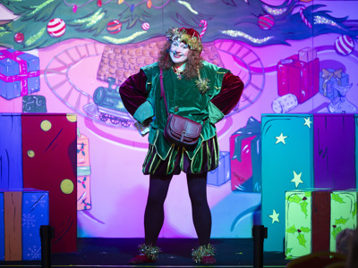 Elf character on stage at Christmas panto