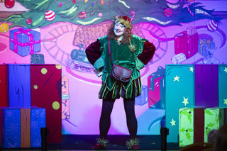 Elf character on stage at Christmas panto