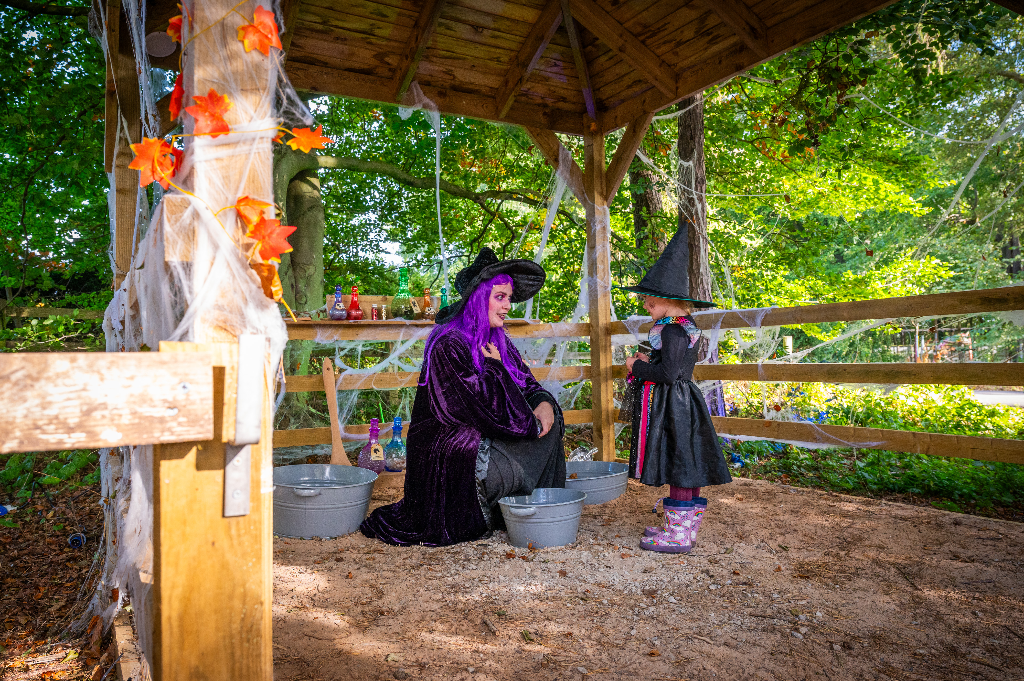  Witch with purple hair Talking To Girl In Witch Costume