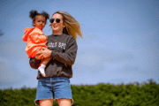 Mother and daughter on giant pillow
