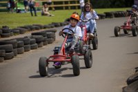 Child on pedal go kart