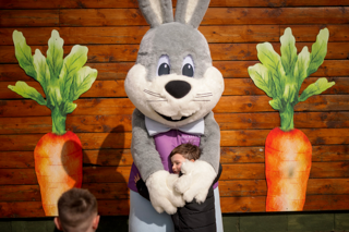 Small child hugging the easter bunny at stockeld park