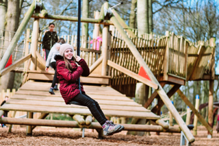 image of a child sliding down one of the activities at Stockeld Park