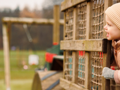 young child and mother in outdoor play area at stockeld park