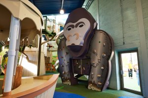 Gorilla climbing wall and interactive game in the jungle zone at the Playhive indoor