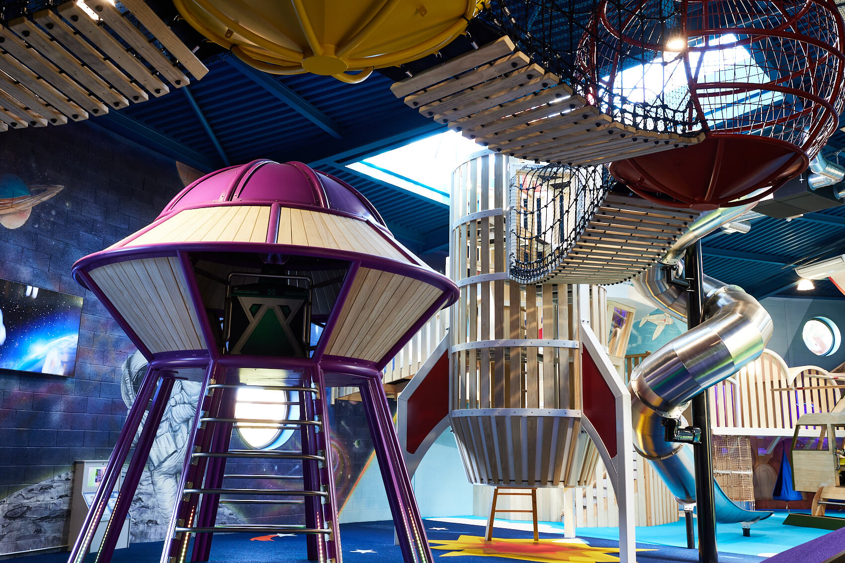 UFO and rocket slide at Playhive, indoor play centre 
