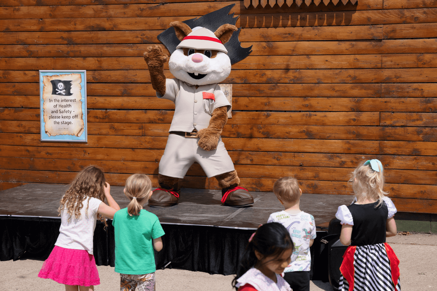 Scout the Squirrel mascot performing on a stage at Stockeld Park