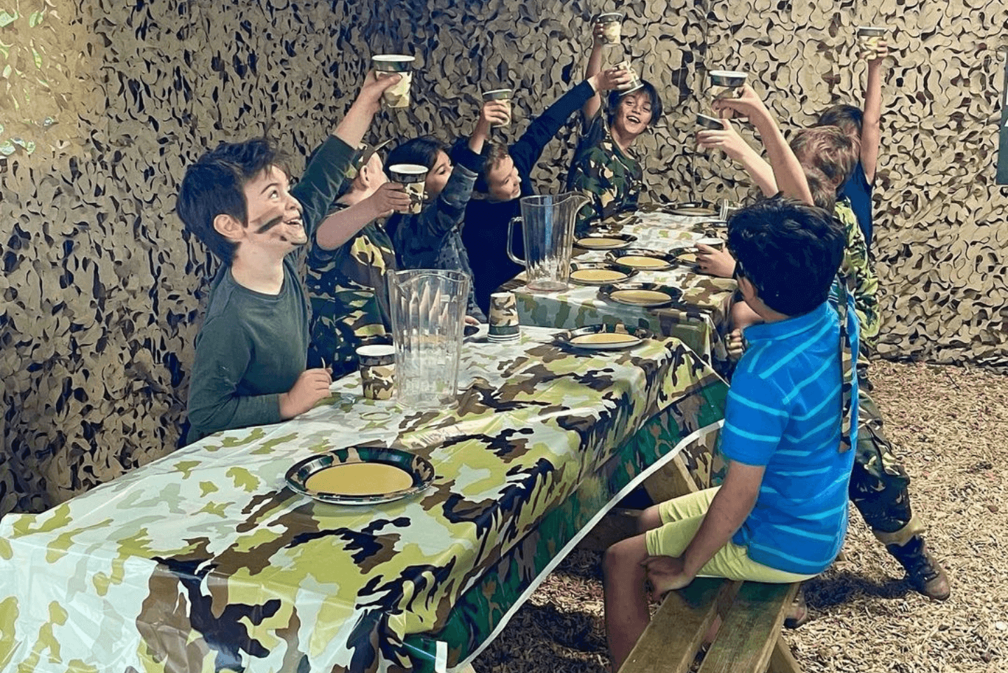 Kids enjoying a celebratory birthday feast after laser tag