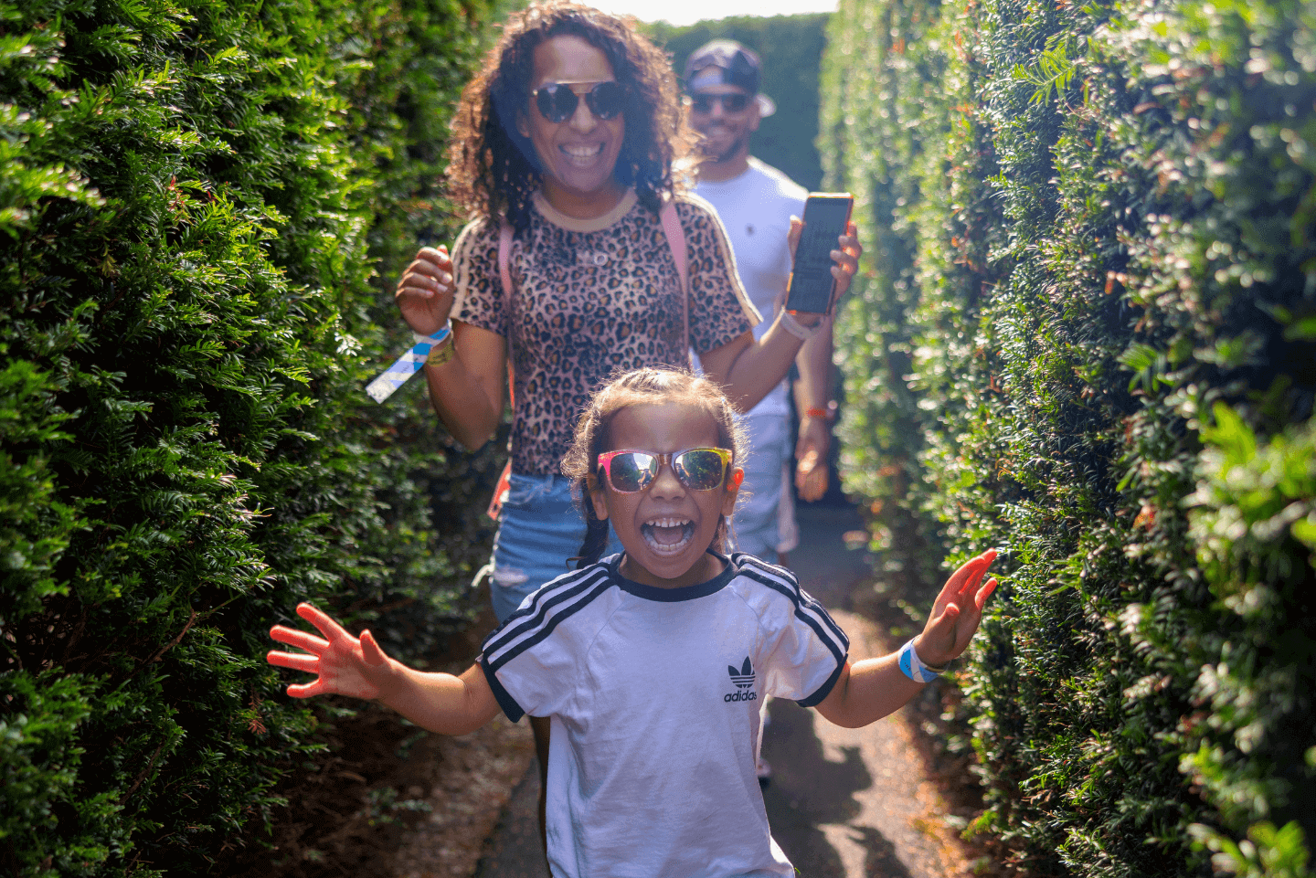 Family navigating Magical Maze in Stockeld Park