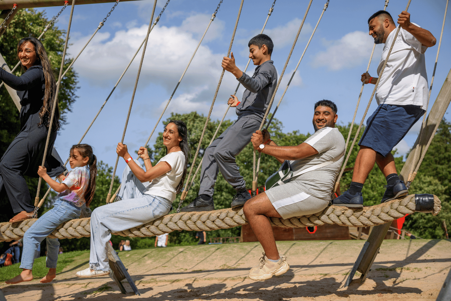 Image of a family playing on swings at Stockeld Park