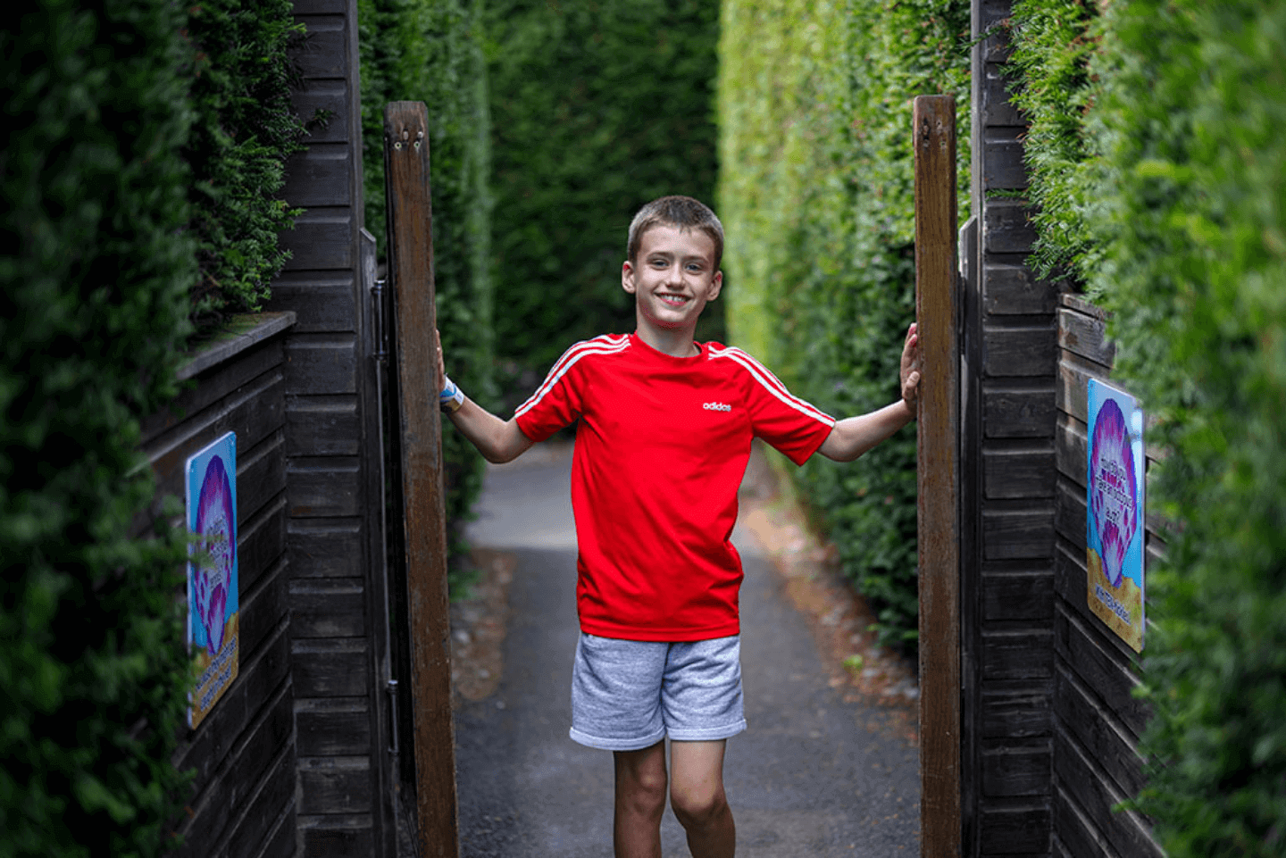 Young boy running through Stockeld Park's magical maze